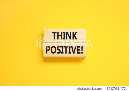 Think positive symbol. Concept words Think positive on beautiful wooden block. Beautiful yellow table yellow background. Business, motivational think positive thinking concept. Copy space. 118761472