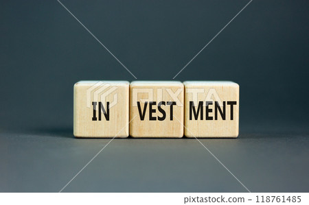 Investment symbol. Concept word Investment on beautiful wooden blocks. Beautiful grey background. Business investment concept. Copy space. Investment symbol. Concept word Investment on beautiful wooden blocks. Beautiful grey background. Business investment concept. Copy space. 118761485