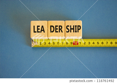 Leadership symbol. Concept word Leadership on beautiful wooden blocks. Beautiful blue background. Beautiful yellow ruler. Business leadership concept. Copy space. 118761492