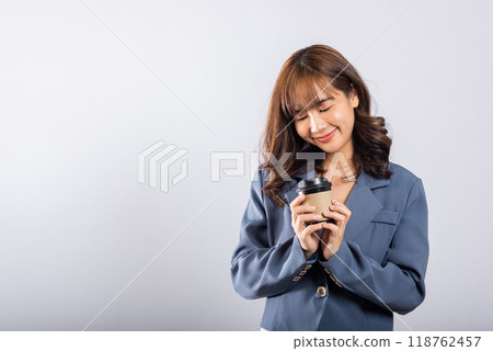Portrait Asian beautiful happy young businesswoman standing smiling holding take away coffee paper cup, studio shot isolated on white background with copy space, coffee break Portrait Asian beautiful happy young businesswoman standing smiling holding take away coffee paper cup, studio shot isolated on white background with copy space, coffee break 118762457