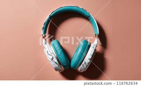 Stylish headphones with a marble design, set on a sleek white surface Stylish headphones with a marble design, set on a sleek white surface 118762634