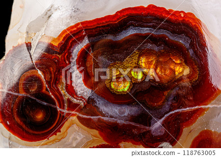 macro mineral stone fire agate on a black background 118763005