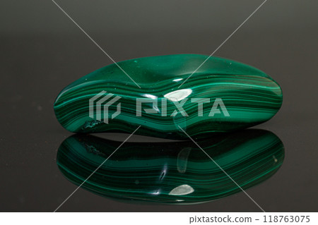 macro mineral stone malachite on a black background macro mineral stone malachite on a black background 118763075