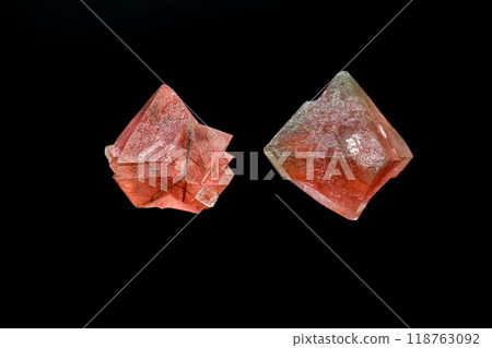 macro mineral stone pink fluorite on a black background 118763092