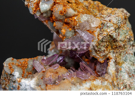 macro mineral amethyst stone in rock on a black background macro mineral amethyst stone in rock on a black background 118763104