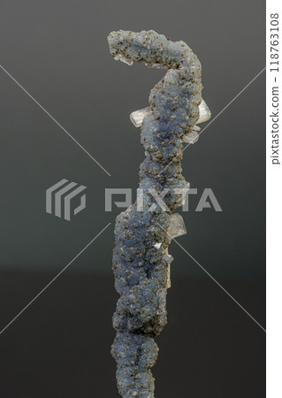 Macro mineral stone chalcedony with stelbite on a gray background Macro mineral stone chalcedony with stelbite on a gray background 118763108