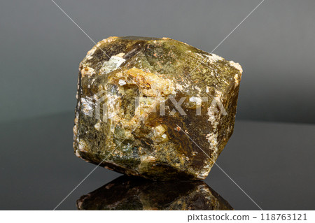 macro mineral stone Andradite on a black background 118763121