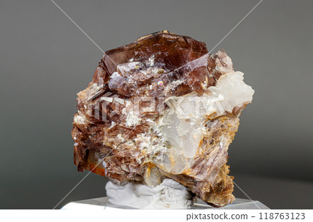 Macro minerals Axinite stone on a gray background Macro minerals Axinite stone on a gray background 118763123