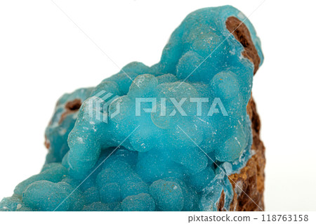Macro pink Smithsonite mineral stone on microcline on white background Macro pink Smithsonite mineral stone on microcline on white background 118763158