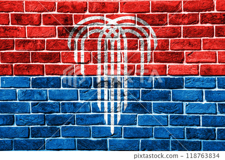Flag of the city of Kansas City, Missouri, USA, on a background of a brick wall. Conceptual collage 118763834