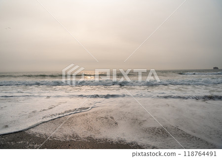 A beautiful view of giant rocks and ocean at Rialto Beach on a cloud day. A beautiful view of giant rocks and ocean at Rialto Beach on a cloud day. 118764491