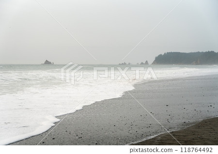 A beautiful view of giant rocks and ocean at Rialto Beach on a cloud day. A beautiful view of giant rocks and ocean at Rialto Beach on a cloud day. 118764492