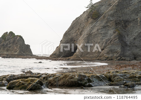 A beautiful view of giant rocks and ocean at Rialto Beach on a cloud day. A beautiful view of giant rocks and ocean at Rialto Beach on a cloud day. 118764495