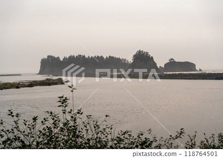 A beautiful view of giant rocks and ocean at Rialto Beach on a cloud day. A beautiful view of giant rocks and ocean at Rialto Beach on a cloud day. 118764501
