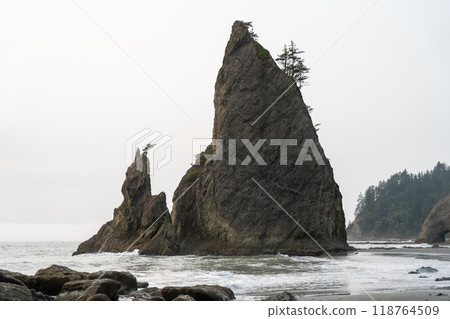 A beautiful view of Split Rock at Rialto Beach on a cloudy day. A beautiful view of Split Rock at Rialto Beach on a cloudy day. 118764509