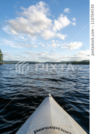 A beautiful view looking out from a kayak on Conway Lake in New Hampshire. 118764530