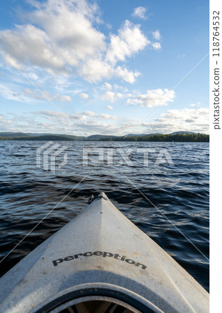 A beautiful view looking out from a kayak on Conway Lake in New Hampshire. 118764532