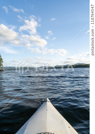 A beautiful view looking out from a kayak on Conway Lake in New Hampshire. 118764547
