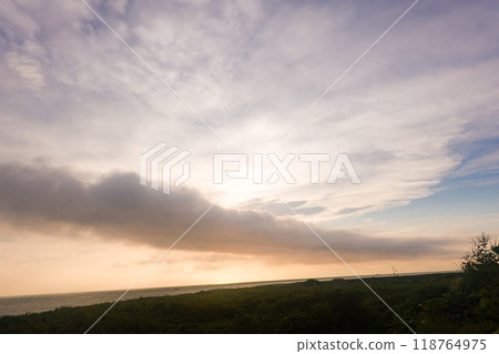 Beautiful sunset with rolling clouds 118764975