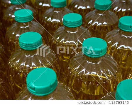 Bottles of cooking oil neatly arranged on grocery store shelves for sale Bottles of cooking oil neatly arranged on grocery store shelves for sale 118765145