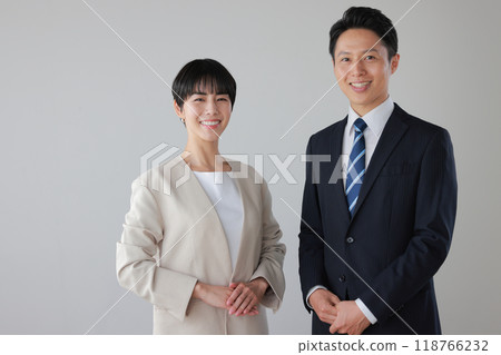 Smiling business people male and female_1 Smiling business people male and female_1 118766232