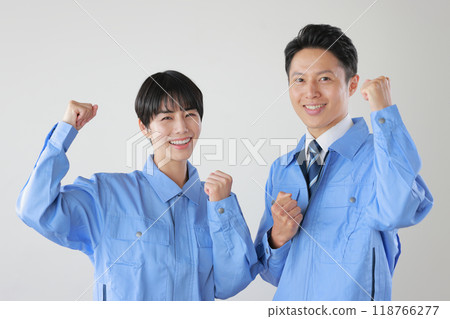 Male and female staff wearing work clothes _ fist pump with both hands _ 1 Male and female staff wearing work clothes _ fist pump with both hands _ 1 118766277