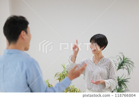 Female vocal trainer and student gesturing to indicate pitch_1 Female vocal trainer and student gesturing to indicate pitch_1 118766804