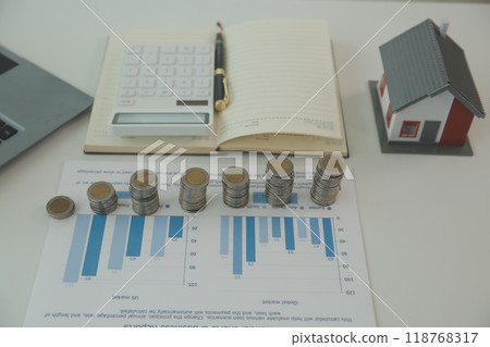 Saving money wealth concept, asian young business woman hand write management budget for saving cost, cash finance planning to spend enough money on her income for save money, payment tax, investing. Saving money wealth concept, asian young business woman hand write management budget for saving cost, cash finance planning to spend enough money on her income for save money, payment tax, investing. 118768317