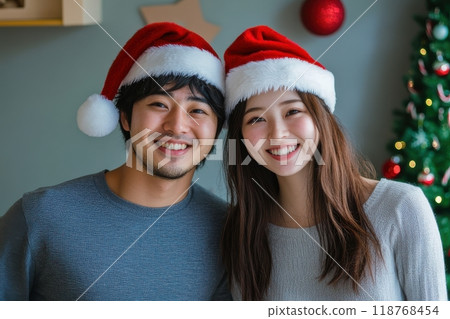 Japanese couple wearing Santa hats and enjoying Christmas (lovers, dating, matchmaking, matching app, winter clothes, 118768454