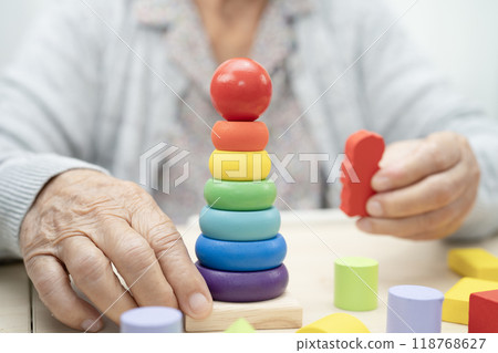 Asian elderly woman playing game. 118768627