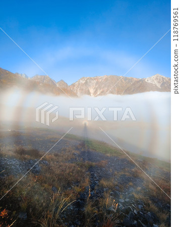 Climbing Mt. Karamatsu in autumn (Brocken phenomenon) 118769561