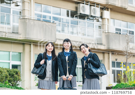 High school girl standing in front of school 118769758