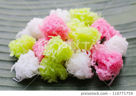 Sweet coconut balls, crispy coconut candies (Maprao Gaew). Thai traditional dessert 118771759