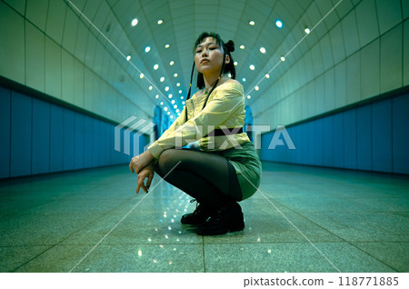 Asian young woman posing in the subway passage. 118771885