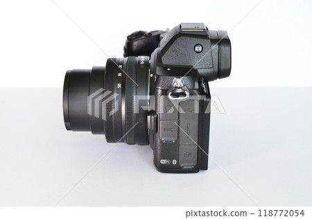 Digital SLR camera and lenses on a white background Digital SLR camera and lenses on a white background 118772054