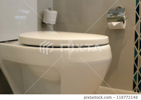 White ceramic toilet bowl in bathroom 118772148