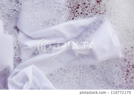 Laundry concept, white shirt soaking in water with detergent water dissolution, washing cloth Laundry concept, white shirt soaking in water with detergent water dissolution, washing cloth 118772179