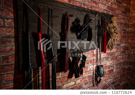 A set of BDSM equipment hanging on the wall. - Stock Photo [118772624] -  PIXTA