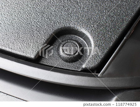 Close up of a plastic fastener clip on car bumper , bumper fastener rivet clip Close up of a plastic fastener clip on car bumper , bumper fastener rivet clip 118774925