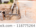 concrete drainage gutter on construction site on road 118775264
