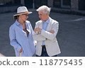 Stylish elderly laughing couple on a walk. Romantic relationships of mature people.  118775435