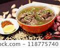 oxtail rib soup or Beef soup in red bowl with ingredients on wooden background, closeup photography  for banner menu restaurant, flyer poster designs, catalogue food dish 118775740
