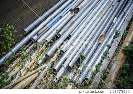 Iron pipes Log house Material storage area Image Iron pipes Log house Material storage area Image 118775923