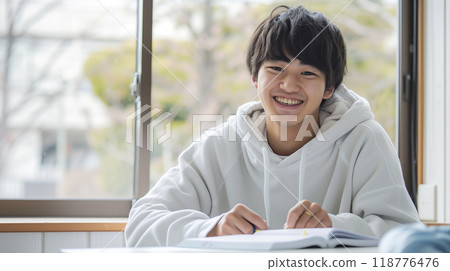 Boys studying to study 118776476