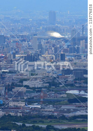 Ikeda City Satsukiyama Hinomaru Observatory View of a plane landing with the Osaka Dome in the background 118776858