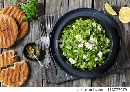 Classic Greek green lettuce salad with feta cheese 118777679