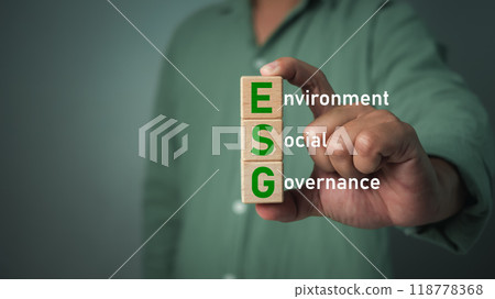 Businessman holding globe with ESG text of saving clean energy environmental, social, governance, sustainable and corporation development, green eco friendly, environment, go green, CO2, ESG concept 118778368