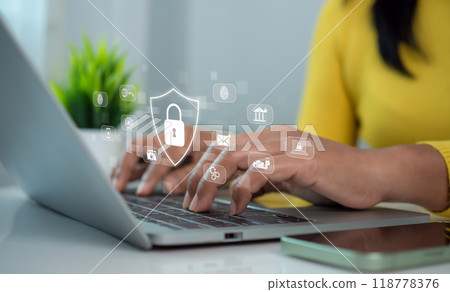 Cybersecurity and Global network security technology concept, Businesswoman protecting personal data on computer with virtual interface, Internet secure technology, Cyber security. 118778376