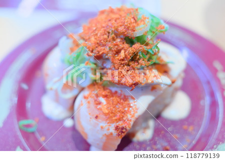 Fresh Sushi from the Conveyor Belt - Spicy Salmon Fresh Sushi from the Conveyor Belt - Spicy Salmon 118779139