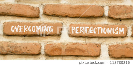 Overcoming perfectionism symbol. Concept words Overcoming perfectionism on beautiful brick wall. Beautiful red brown brick wall background. Business Overcoming perfectionism concept. Copy space. Overcoming perfectionism symbol. Concept words Overcoming perfectionism on beautiful brick wall. Beautiful red brown brick wall background. Business Overcoming perfectionism concept. Copy space. 118780216